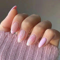 Hand with pink nail polish on a pink textured fabric background, Obroi