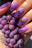 Nails with grape design and real grapes on a white background, Obroi