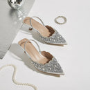 Silver embellished high heels on a light background, Obroi