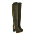 Pair of green knee-high boots on a white background, Obroi