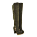 Pair of green knee-high boots on a white background, Obroi