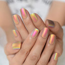 Close-up of hands with iridescent nail polish on a blurred background,Obroi