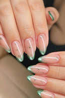 Nails with a gradient design transitioning from pink to green, featuring small decorative elements, Obroi