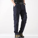 Person wearing navy cargo pants on a white background, Obroi