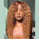 Person with long, curly blonde hair in front of a light blue wall, Obroi