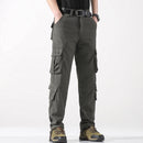 Person wearing olive green cargo pants on a white background, Obroi