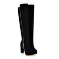 Black knee-high boots with a gold zipper on a white background, Obroi