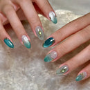 Close-up of hands with teal and pink nail polish on a textured surface, Obroi