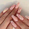 Pink nail art with butterfly and flower designs on a neutral background, Obroi