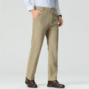 Beige pants worn by a person on a light gray background, Obroi