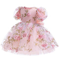 Pink floral dress with matching bonnet on a white background, Obroi