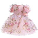 Pink floral dress with matching bonnet on a white background, Obroi