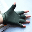 Green half-finger glove on a person's hand against a light background, Obroi