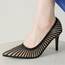 Black high-heeled shoe with mesh design on a light background, Obroi