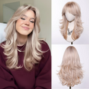 Woman with long blonde hair next to a wig on a mannequin head and another wig on a white background, Obroi