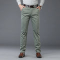 Person wearing light green pants with a gray background, Obroi