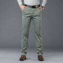 Person wearing light green pants with a gray background, Obroi