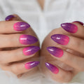Close-up of hands with pink and purple gradient nail polish on a blurred background, Obroi