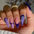 Hand with purple and pink gradient nails and gold accents, Obroi
