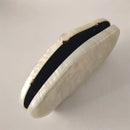 White oval clutch with black interior on a light gray background, Obroi
