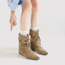 Beige ankle boots worn with white socks on a light gray background, Obroi