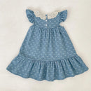 Blue dress with white floral pattern on a light gray background, Obroi