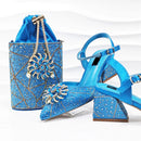 Blue embellished shoes and handbag on a white background with 'Obroi' branding.