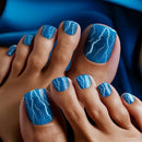 Nails with blue nail polish and white lightning designs on a blue background, Obroi