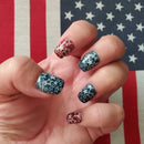Hand with star-patterned nails against an American flag background, Obroi