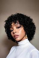 Woman with styled hair wearing a white turtleneck against a neutral background, Obroi