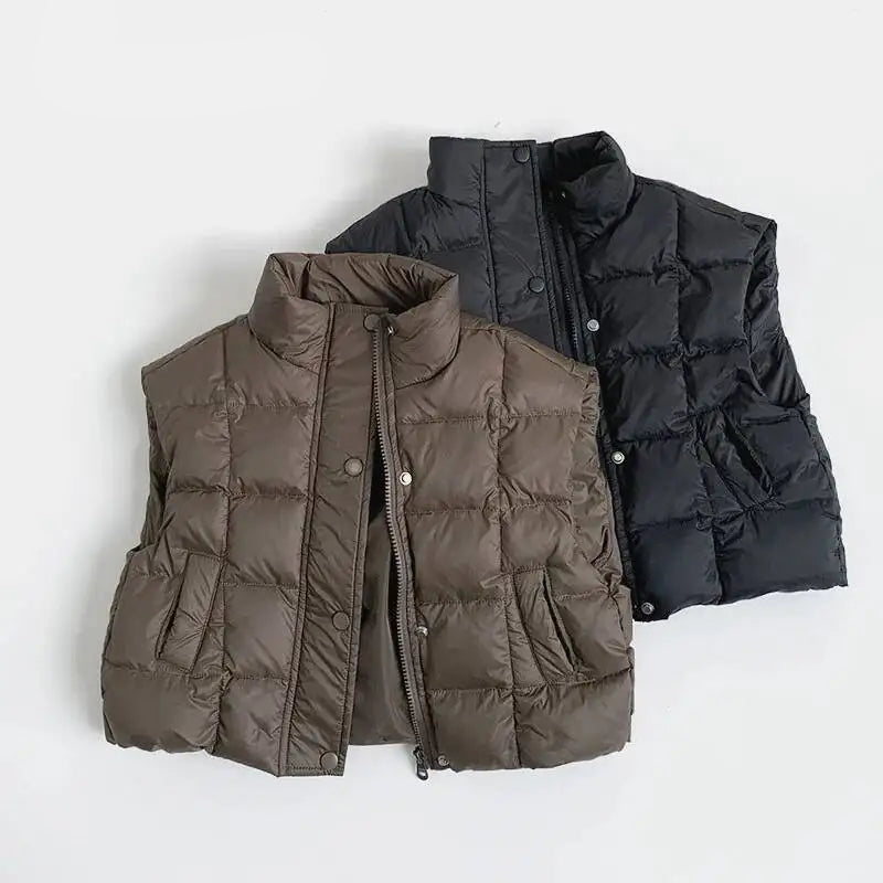 Two puffer vests, one brown and one black, on a white background with Obroi branding.