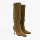 Pair of brown knee-high boots on a white background, Obroi