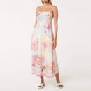 Woman wearing a floral dress with 'VGH' branding on a white background