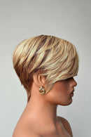 Mannequin head with a styled haircut on a plain background, Obroi
