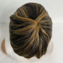 Close-up of a person with styled hair on a plain background, Obroi