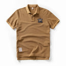 Brown polo shirt with a logo on a white background, Obroi