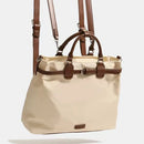 Beige handbag with brown straps on a white background, Obroi