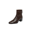 Brown leather ankle boot with a close-up of the sole on a white background, Obroi
