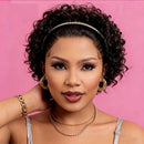 Woman with styled hair and jewelry against a pink background, Obroi