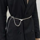 Black coat with a silver belt featuring a snake design on a neutral background, Obroi
