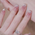 Close-up of a hand with clear nail polish and a silver ring on a blurred background, Obroi