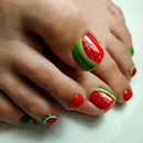 Toes with watermelon-themed nail art on a white background, Obroi