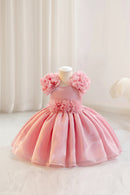 Pink flower girl dress on a mannequin against a white background, Obroi