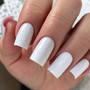 Close-up of a hand with white nail polish on a neutral background, Obroi