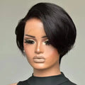 Mannequin head with a black wig on a gray background, Obroi
