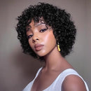 Woman with styled hair wearing a white top against a neutral background, Obroi