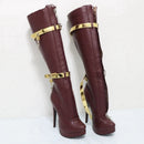 Maroon knee-high boots with gold straps on a white background, featuring the brand 'Obroi'.