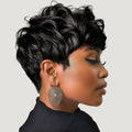 Woman with styled hair wearing large earrings on a neutral background, Obroi