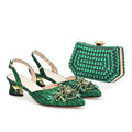 Green embellished shoes with matching clutch on a white background, Obroi