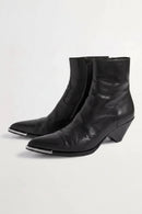 Black leather ankle boots with metallic accents on a white background, Obroi 